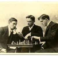 Three male students playing chess, 1896